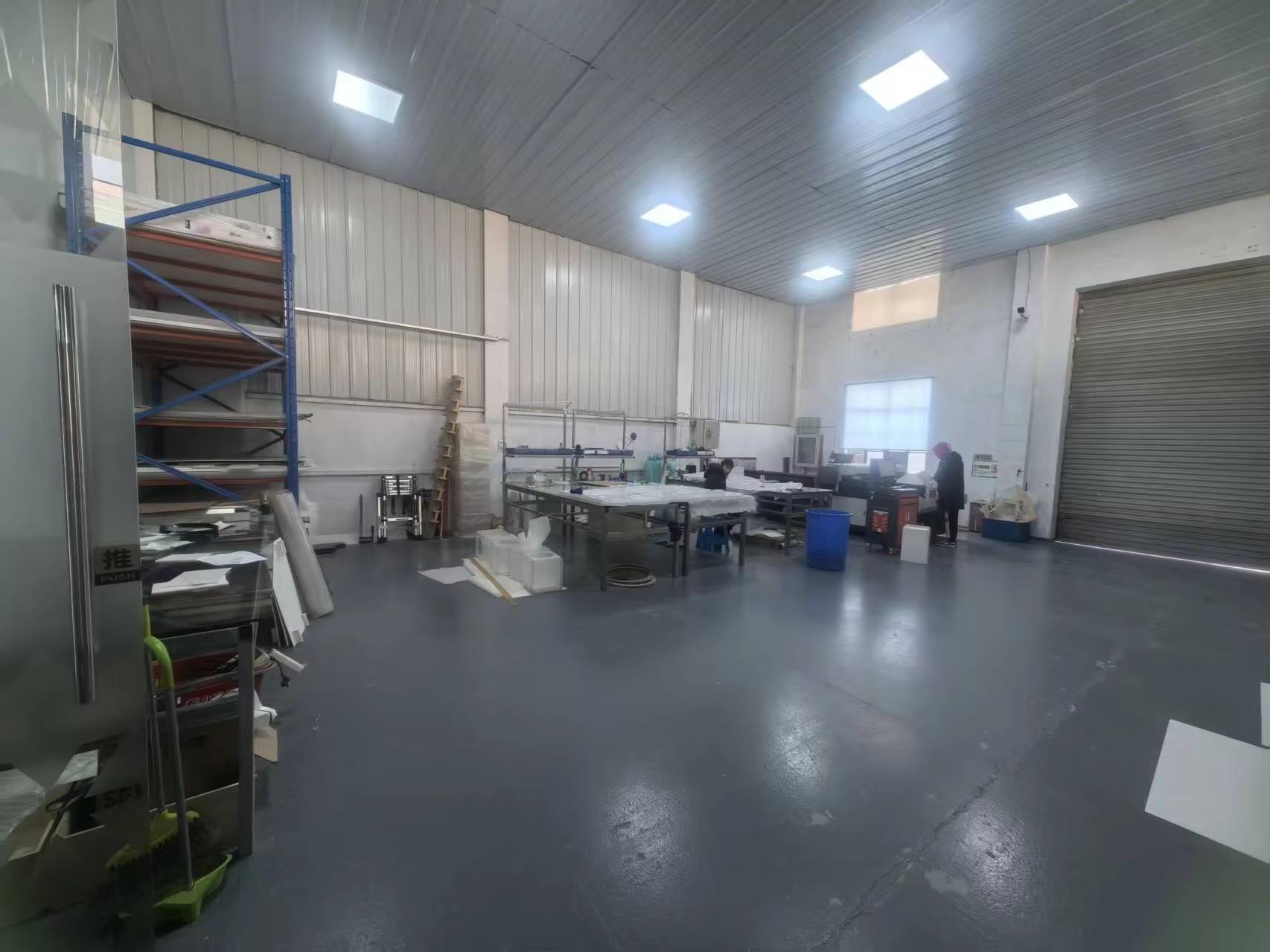 Key-Joint production workshop with worktables, material racks and finishing stations